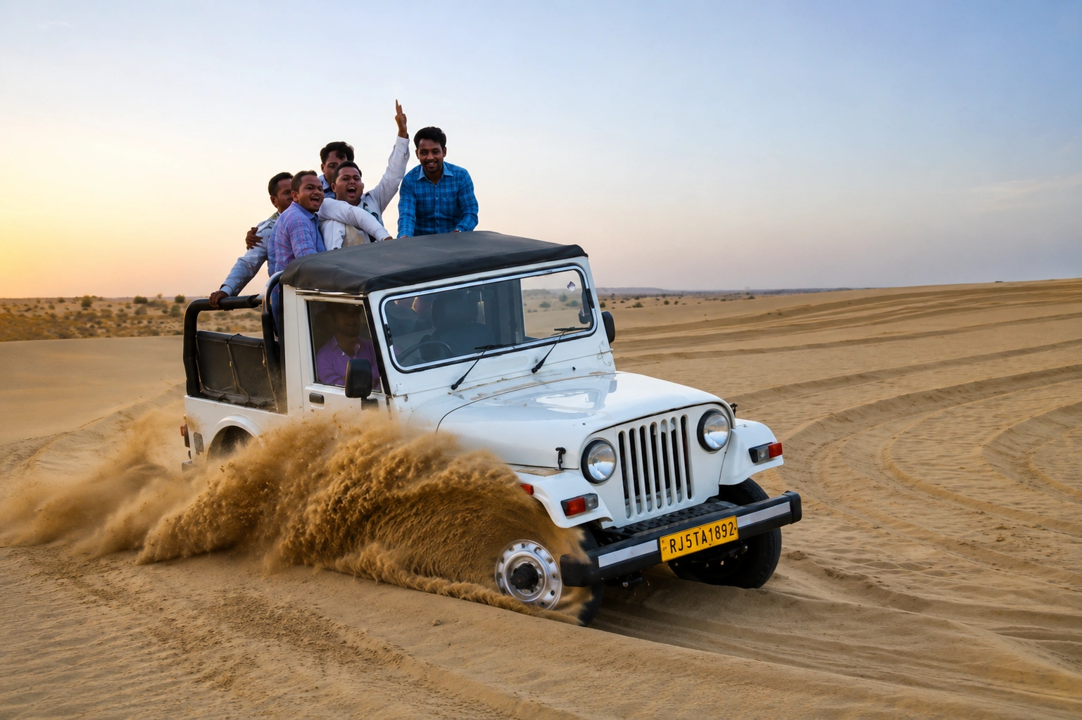 Jeep safari dune-bashing at sunset